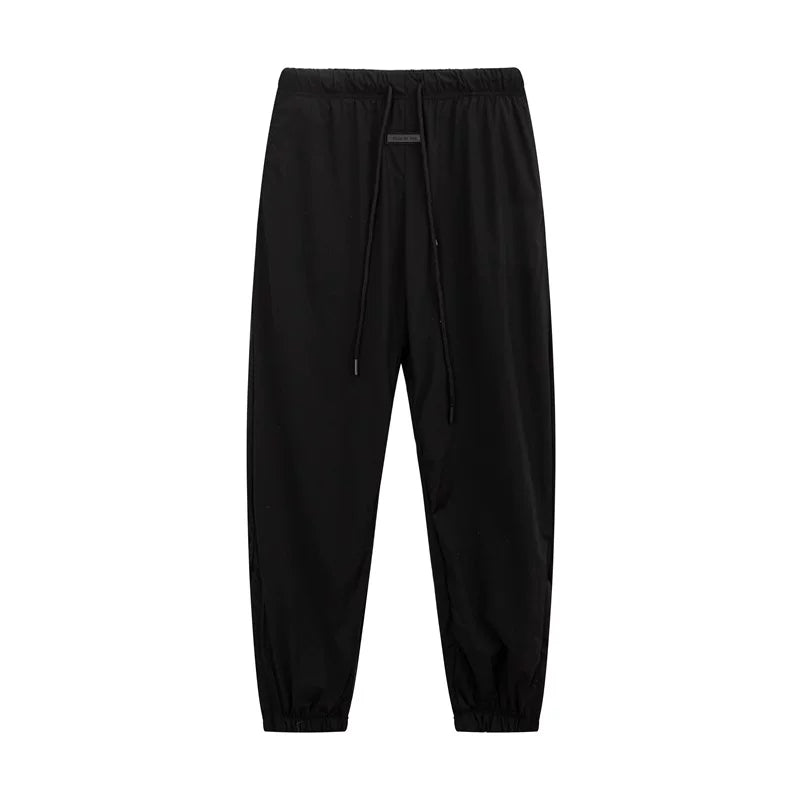 Fear of God Essentials Zipper‑Cuff Nylon Jogger Pants