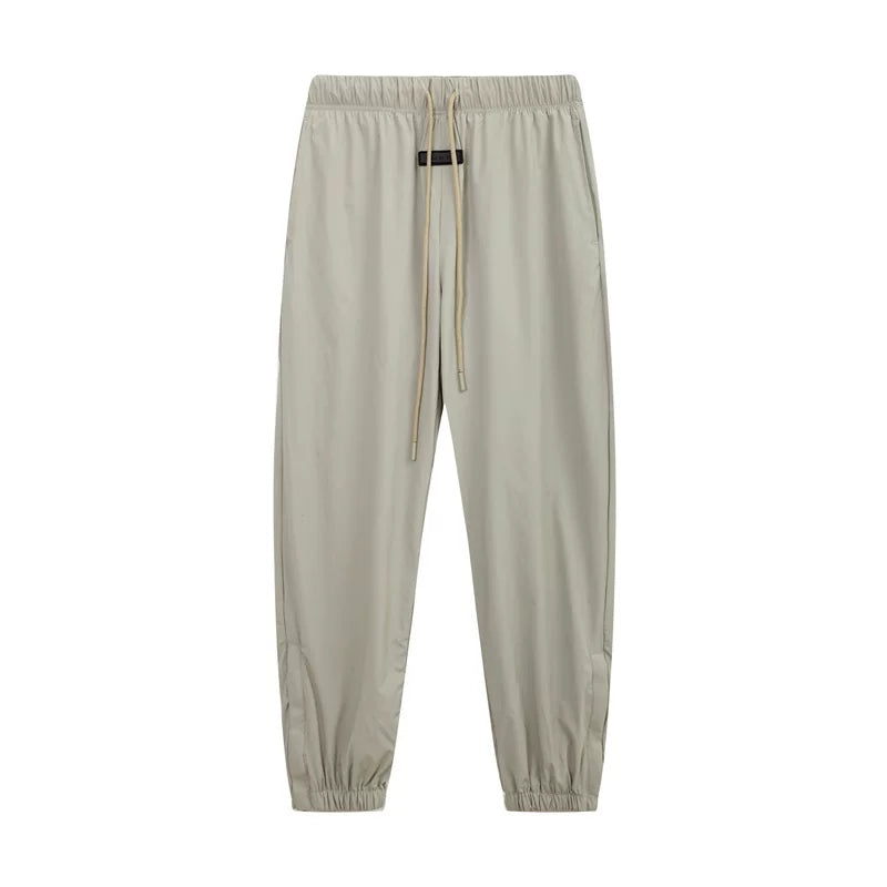 Fear of God Essentials Zipper‑Cuff Nylon Jogger Pants